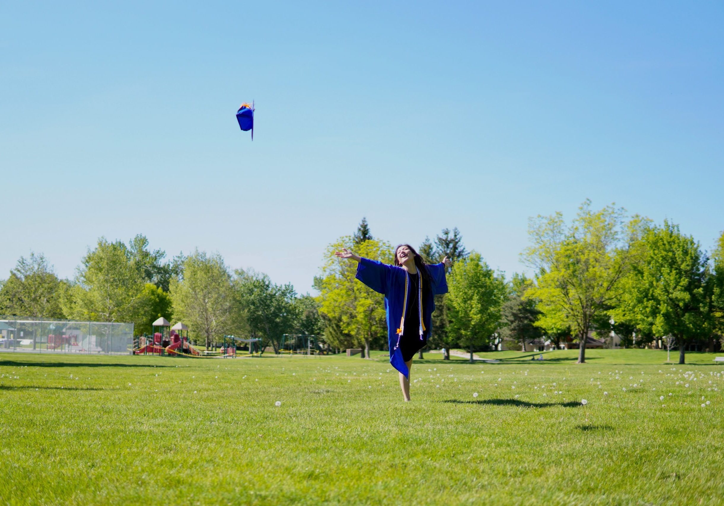 College graduate throwing cap