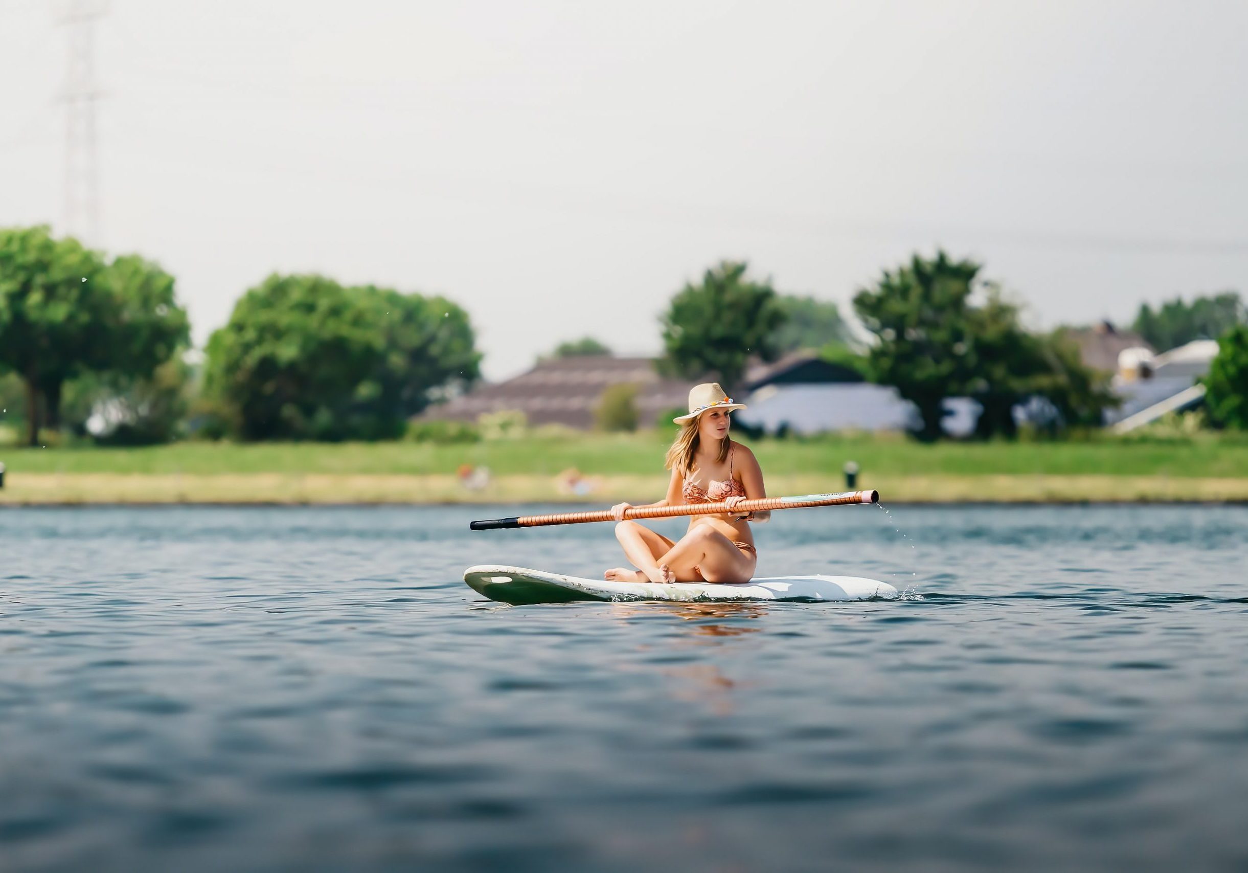 Girl sitting on a paddleboard